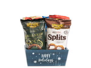 Blue Happy Holiday dark blue box with white snowflakes all over the box and the words happy holidays written in white cursive filled with various Unique Snacks products