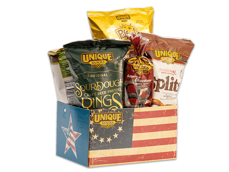 COLONIALBX-colonial-flag-basket-box-full-new Colonial flag basket box with the original American flag on it, filled with various Unique Snacks products