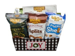 Large Joy Black Tray filled with various Unique Snacks products